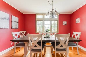 Formal dining room includes seating for eight and dishware for every occasions.