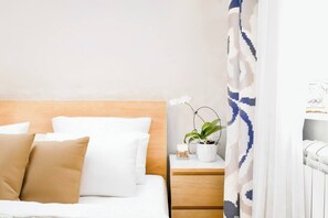 Drift into peaceful sleep in the tranquil bedroom, designed with soft tones, a comfortable bed, and beautiful touches that create a calming atmosphere.