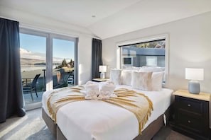 Relax in a second king bedroom with dual-aspect windows and lake views.