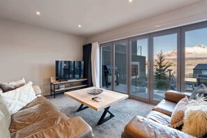 
Unwind with a movie on the large TV in the bright lounge.