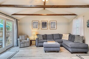 Spacious great room area with flat screen tv and board games