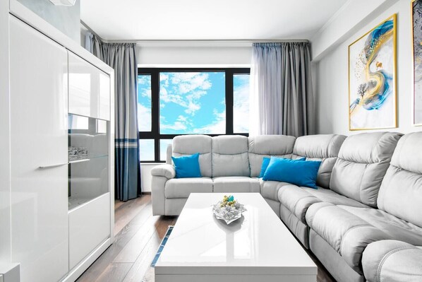 Relax in the cozy seating area with stunning views and a 65” Smart TV.