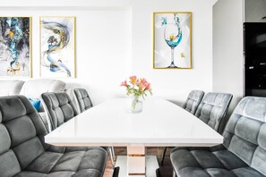 Gather around the elegant dining table, perfect for meals or work.