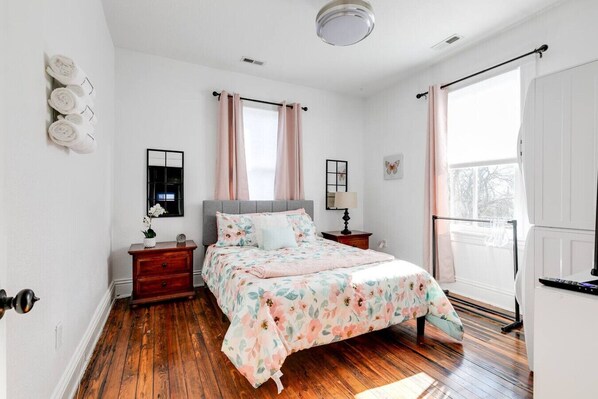 An elegant and romantic retreat with plenty of natural lighting. Queen sized bed. Features a flat-screen Roku TV, a washer and dryer, an ironing board, and a clothing rack for your convenience.