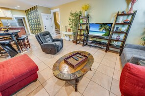- Kick back and watch your favorite shows in this inviting entertainment space - Comfortable seating and warm decor make it perfect for movie nights or downtime - Thoughtfully designed for relaxation, with a blend of style and function