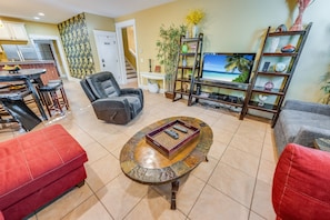 - Kick back and watch your favorite shows in this inviting entertainment space - Comfortable seating and warm decor make it perfect for movie nights or downtime - Thoughtfully designed for relaxation, with a blend of style and function