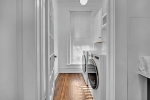 Laundry Room: Modern washer and dryer set, designed for efficiency and convenience, seamlessly fitting into the laundry room for all your cleaning needs.
