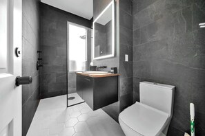 Second unit - Modern comfort meets functionality in this stylish bathroom.