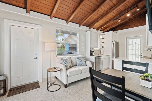 Inviting, renovated space with volume ceilings. 