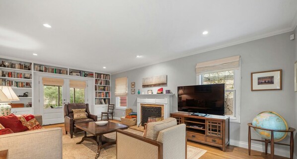 Books, comfy seating, and a large TV make this living room the perfect spot to unwind.