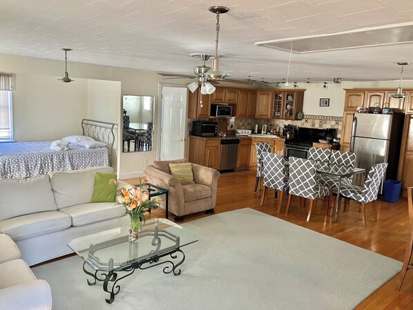 Upstairs of house with kitchen full bar and dining space. Also a queen bed