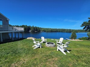 Generous waterfront yard with fire pit