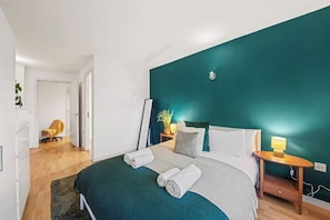 Every detail of the bedroom, from curated artwork to plush textures, is thoughtfully chosen to elevate relaxation, ensuring restful nights and rejuvenating mornings.