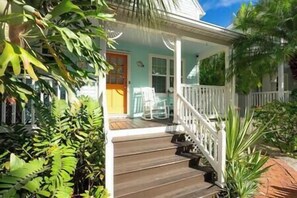 A great front porch with 2 rocking chairs and a bistro table.