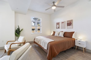 Bedroom #1 with a comfy King bed, 50-inch TV, Workspace, and sitting area!