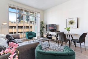 Stylish 3 bedroom, 2 bathroom apartment complete with a full kitchen, Living Area, AC, desk, TV, washer/dryer, balcony, & much more!