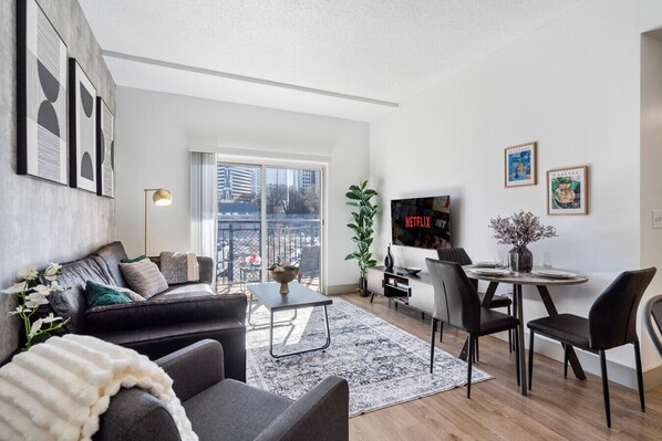 Delightful 4 bedroom, 2 bathroom apartment complete with a full kitchen, Living Area, AC, desk, TV, washer/dryer, balcony, & much more!