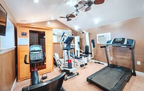 fitness/exercise room with sauna