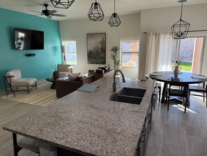 Open concept kitchen, living, and dining area