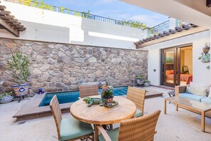 Dinning Room 4 seaters with view to heated pool.
