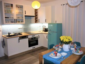 Cabinetry, Property, Furniture, Countertop, Blue, Table, Kitchen Stove, Sink, Interior Design, Kitchen