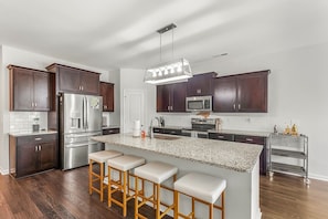 Spacious kitchen with breakfast bar seating