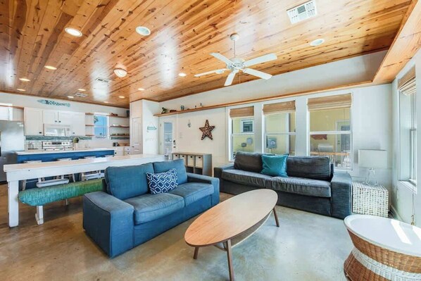 Living room includes 2 couches and 2 arm chairs. Newly updated flooring (not pictured). 