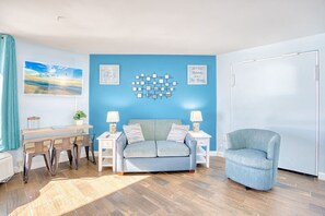 This beach themes condo sets the tone with natural lighting which fills the room and heart by day with energy and anticipation for the days events.  At night, unwind and pull down the queen-sized murphy bed with its plush mattress.  Fall in love!