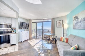 Spacious Livingroom with spectacular views of the ocean, beach, Myrtle Beach skyline, and gorgeous sunsets.  This is the spot for watching fireworks in Myrtle Beach