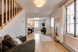 Living room and desk view with entrance