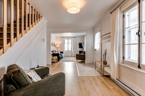 Living room and desk view with entrance