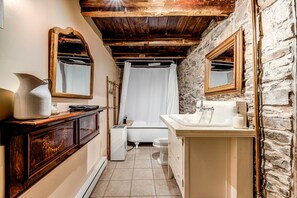 Second bathroom with bath and shower