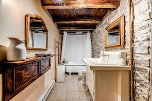 Second bathroom with bath and shower