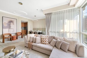 Living Room: Relax in style with chic decor, plush seating, and stunning city views!