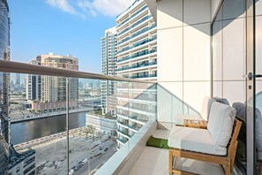 Balcony Serenity: Sip your morning coffee with stunning city views from this sleek retreat!