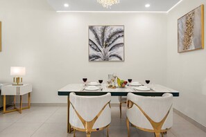 Dining Room: Dine in style under a shimmering chandelier, surrounded by elegant decor!