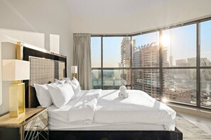 Bedroom Oasis: Elegant retreat with panoramic city views and sleek, modern furnishings!