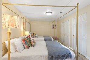 Bedroom 2- 2 queen beds, seating area, Frida Khalo decor, retro style and design