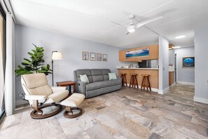 Spacious living room with large windows and abundant natural light.