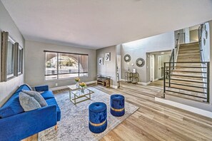 Living Room: Bright and airy space with chic accents, perfect for relaxation after Vegas adventures!