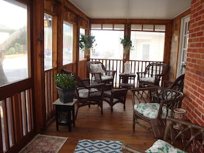 Plenty of seating is available on the front porch where you can sit and people watch as they head to the beach!