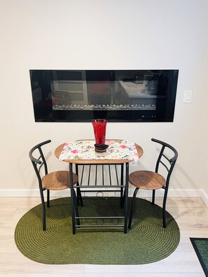 electric fireplace, dining space for two