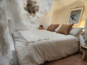 Bedroom with two mattress, queen size bed.