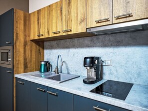 Kitchen, Countertop, Kitchen Appliance, Interior Design, Cabinetry, Wood, Major Appliance, Home Appliance, Flooring, Plumbing Fixture