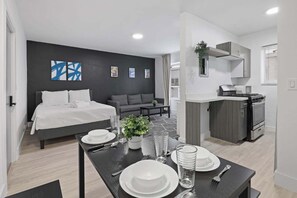 Modern studio apartment with sleek design, perfect for a cozy getaway. Enjoy the comfort of home with a stylish touch.