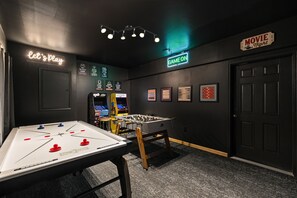 Retro Game Room Fun
Let the games begin! Air hockey, arcade classics, and movie-themed vibes make this the ultimate hangout zone.