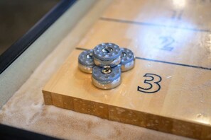 Unleash your competitive side with shuffleboard & board games!