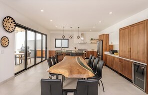 Dining area and view into Large Modern Kitchen