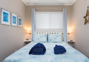 This bedroom includes a queen sized bed