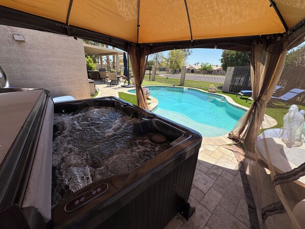 Brand new hot tub under cabana overlooking private pool with Baja Bench. 